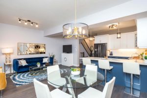 Main living area with blue kitchen